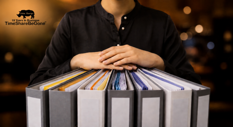 Woman organizing timeshare contract files with TimeShareBeGone branding