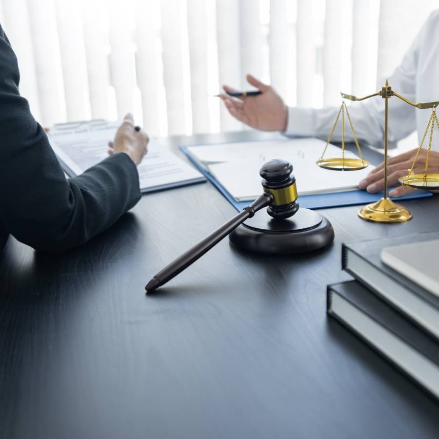 Legal consultation with gavel and justice scales—TimeshareBeGone provides expert timeshare cancellation services in New York, helping clients navigate contracts and protect their rights.