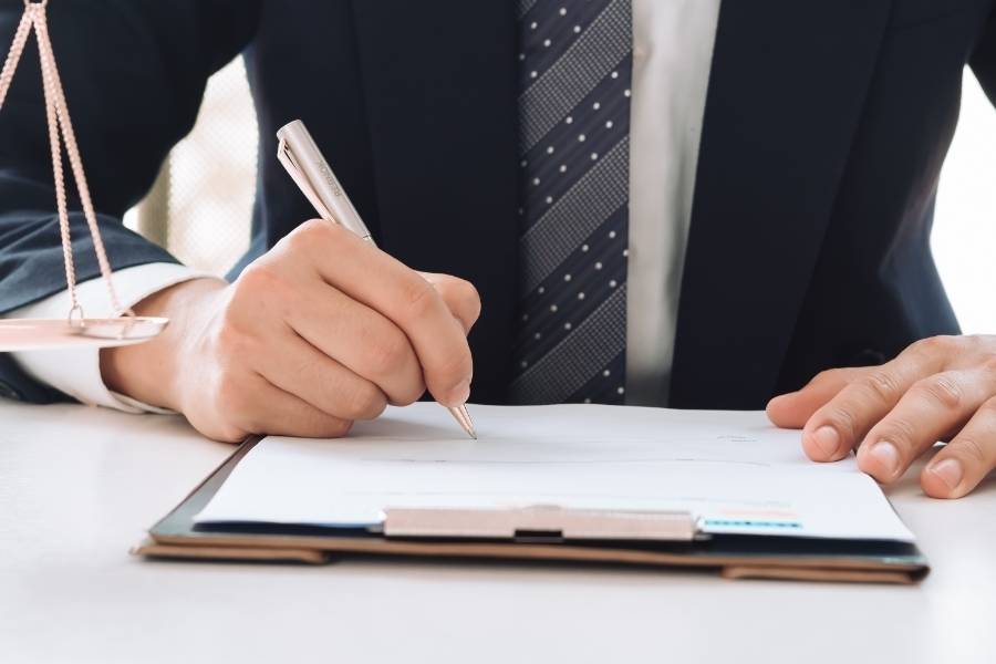 Attorney signing legal documents for timeshare cancellation in Atlanta, Georgia