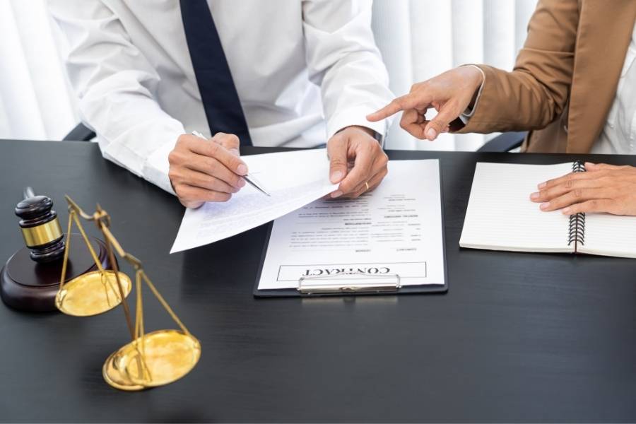 Lawyer reviewing timeshare contract with client during cancellation consultation in Augusta, Georgia