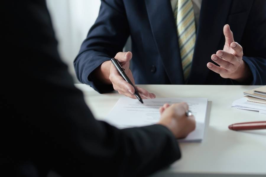 Consultant discussing timeshare cancellation paperwork with a client in Orlando, Florida.