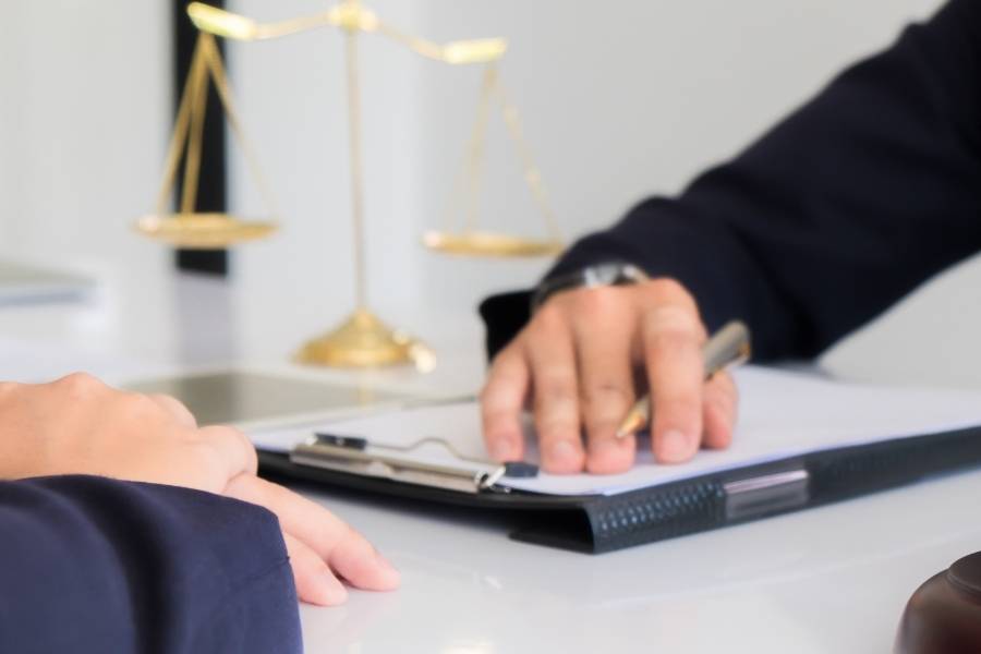 Lawyer reviewing timeshare cancellation paperwork with client in Savannah, Georgia