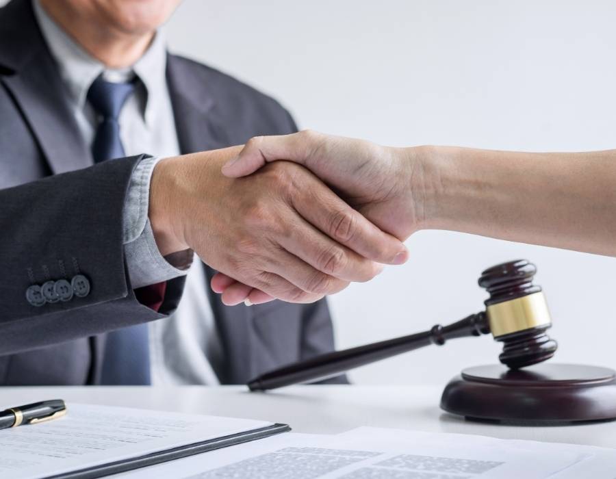 timeshare lawyer handshaking to a client