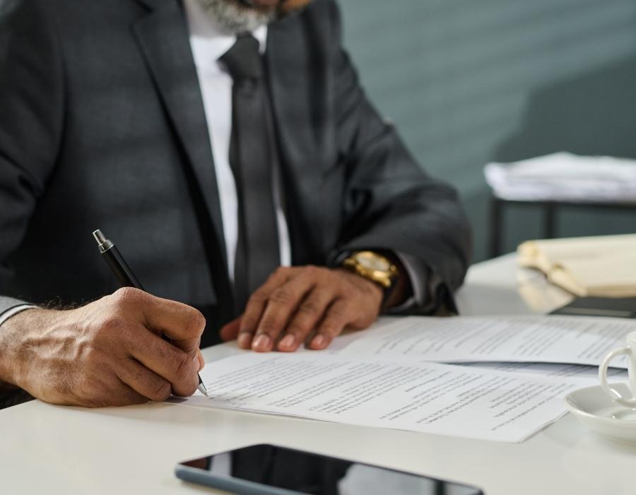 timeshare lawyer signing a timeshare cancellation contract