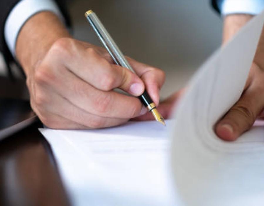 timeshare lawyer signing a timeshare cancellation contract