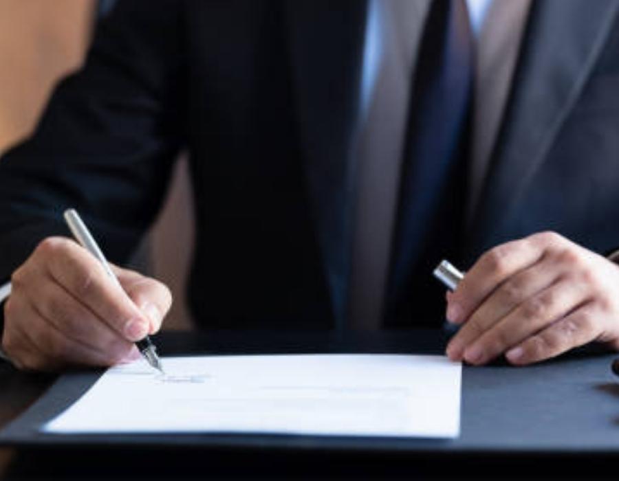 timeshare lawyer signing a contract