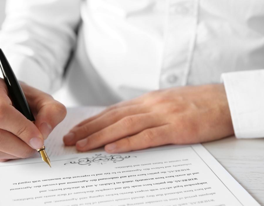 timeshare lawyer signing a timeshare cancellation contract