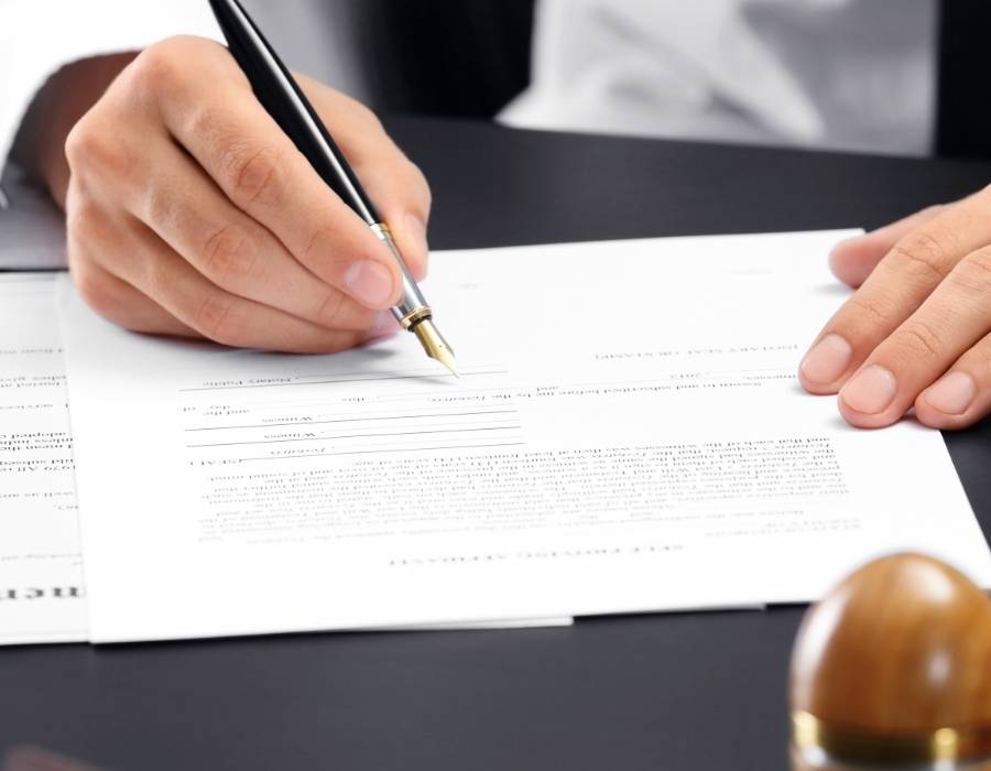 timeshare lawyer signing a timeshare cancellation contract
