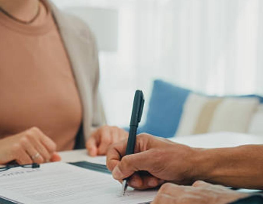 timeshare lawyer signing a client contract