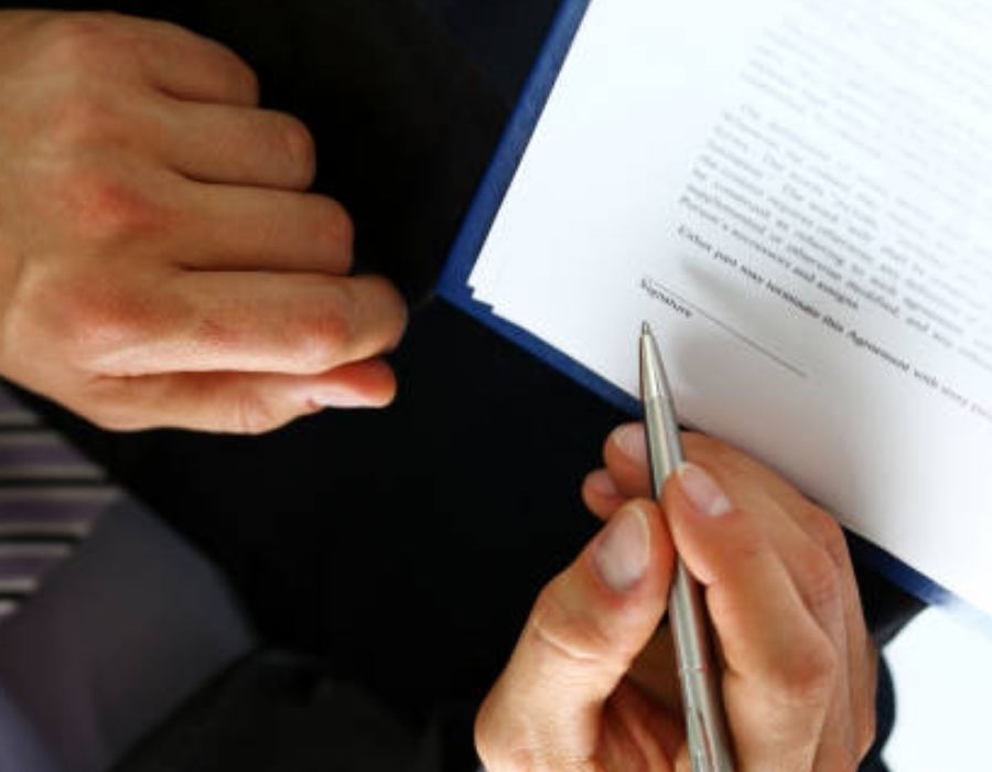 timeshare lawyer signing an timeshare cancellation contract