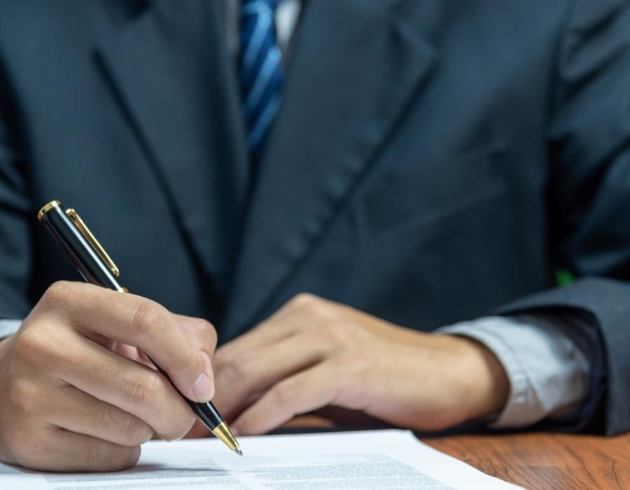 timeshare lawyer signing a timeshare cancellation contract