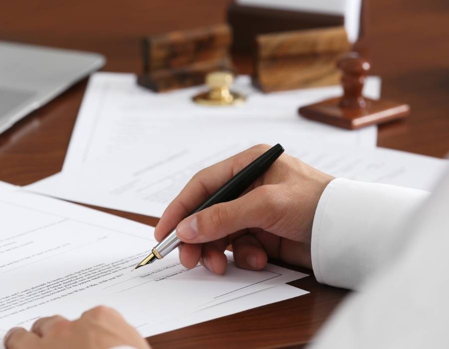 timeshare lawyer signing a timeshare cancellation contract