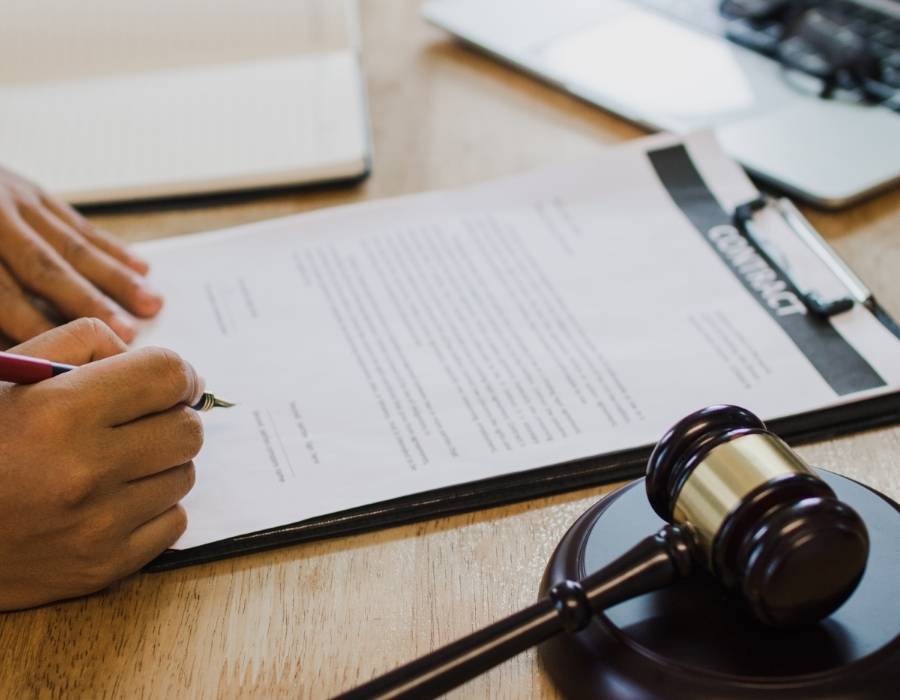 timeshare lawyer signing a timeshare cancellation contract