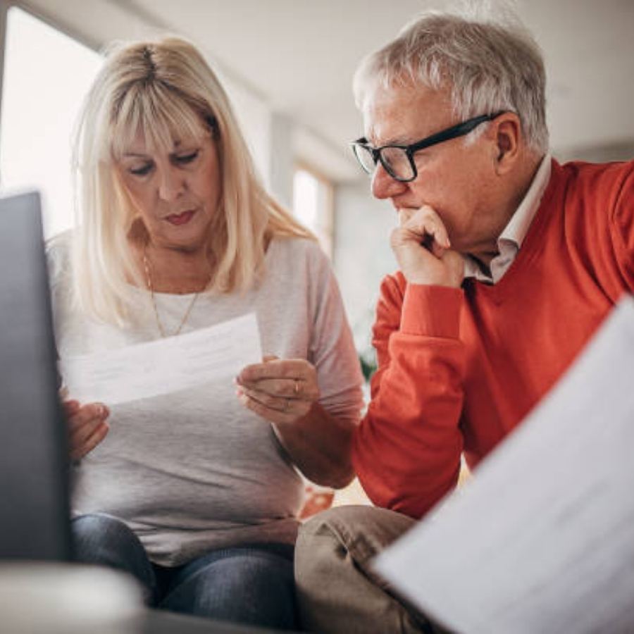senior couple reviewing timeshare documents