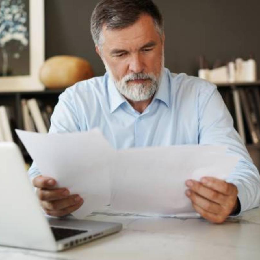 senior man reviewing a timeshare contract
