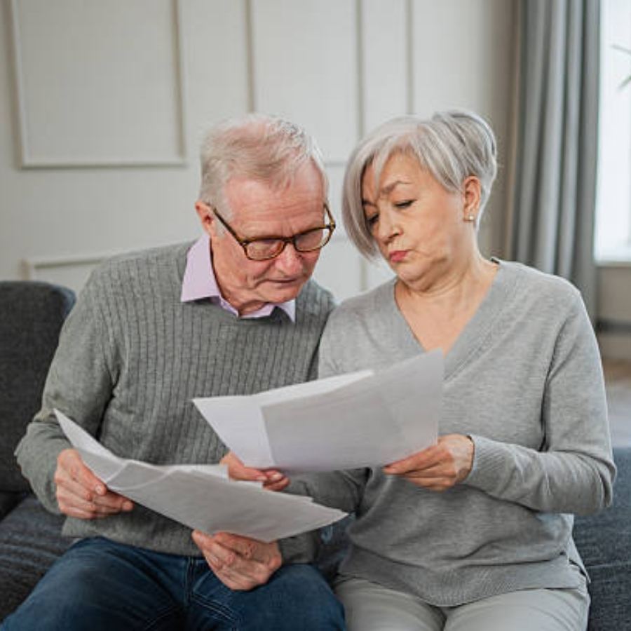 senior couple reviewing timeshare documents