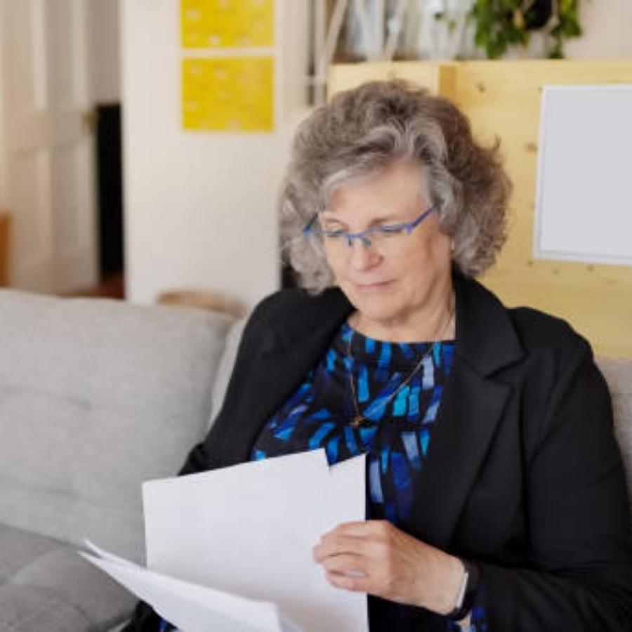 senior woman reviewing a timeshare contract