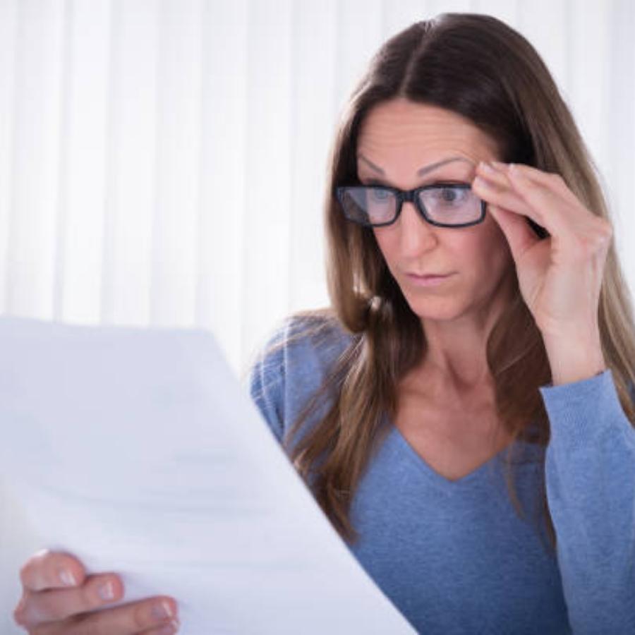 senior woman reviewing a timeshare contract