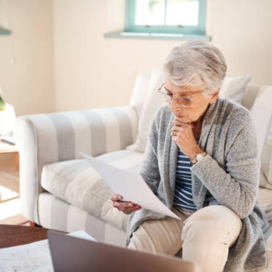 senior woman reviewing a timeshare contract