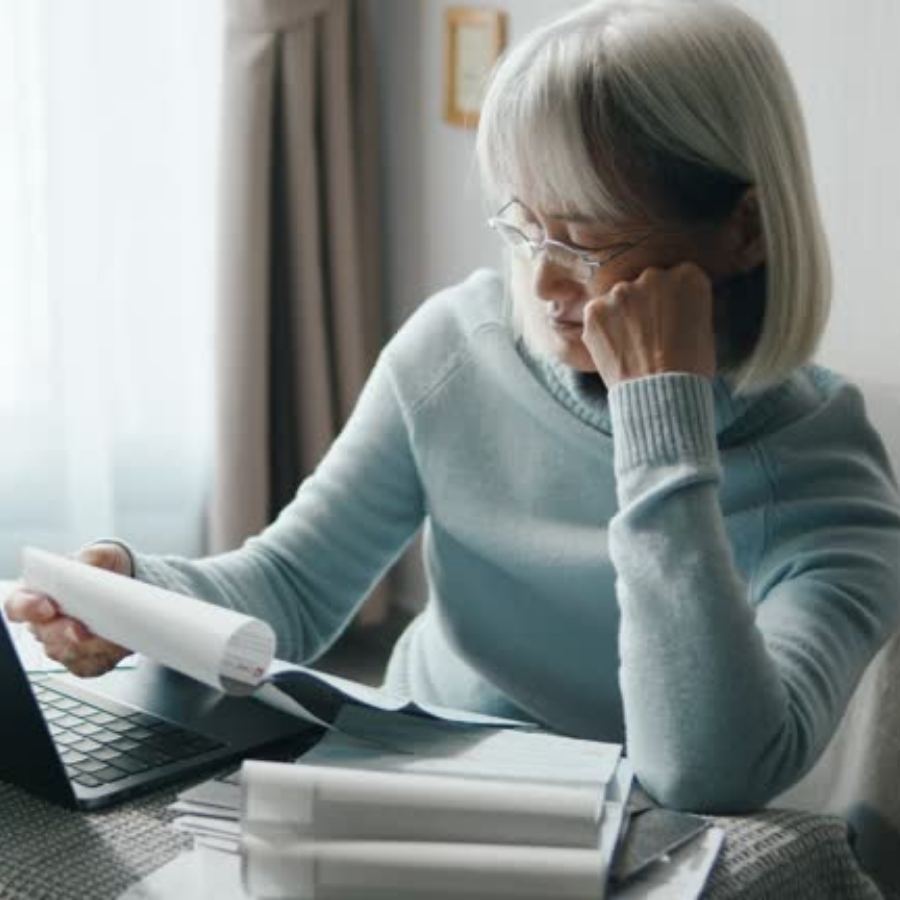 senior woman reviewing timeshare document