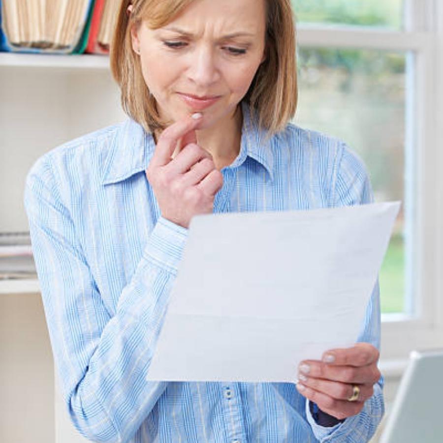 senior woman reviewing a timeshare contract