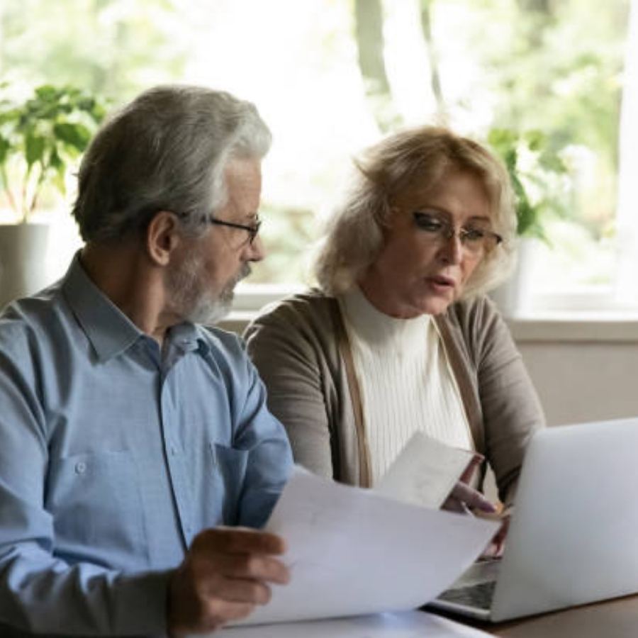 senior couple reviewing timeshare contract