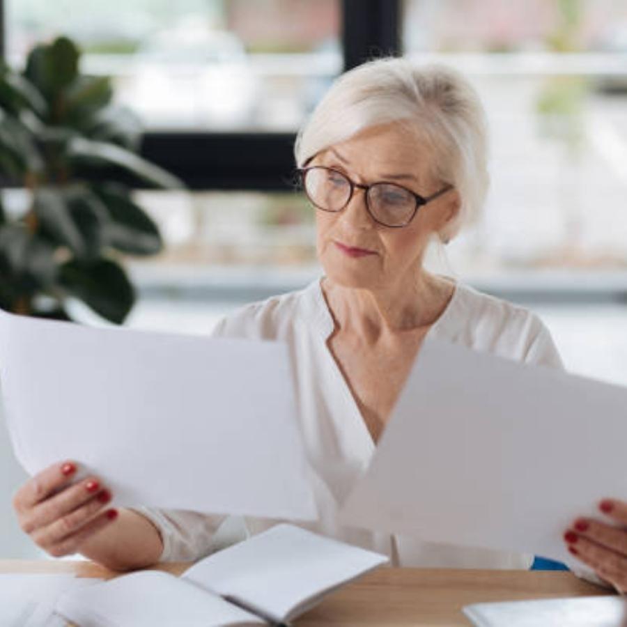 senior woman reviewing a timeshare contract