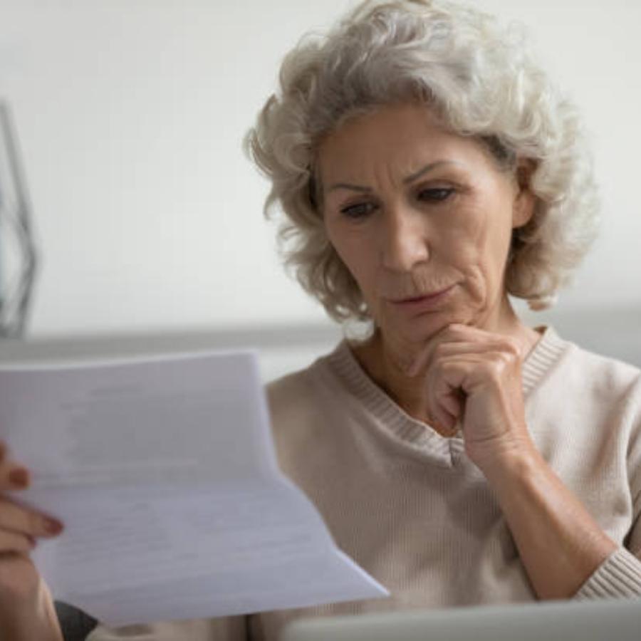 senior women reviewing timeshare cancellation contract