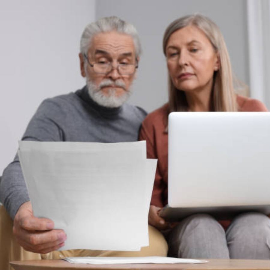 senior couple reviewing timeshare contract