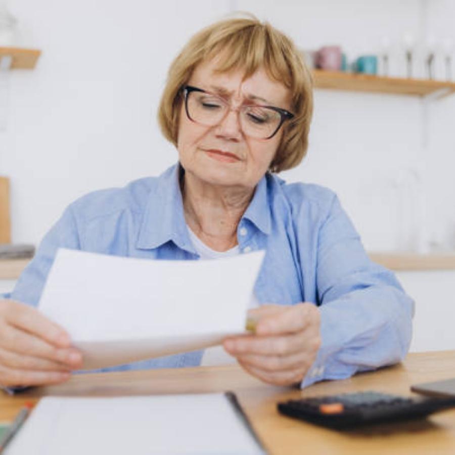 senior woman reviewing timeshare contract