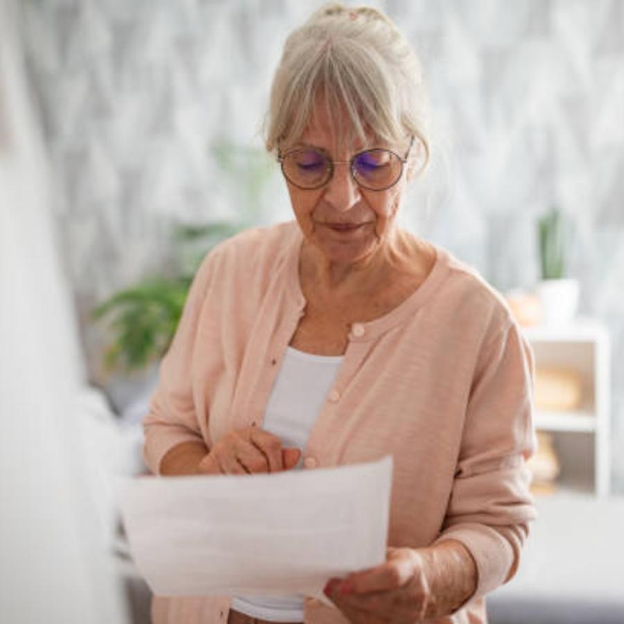 senior woman reviewing a timeshare contract