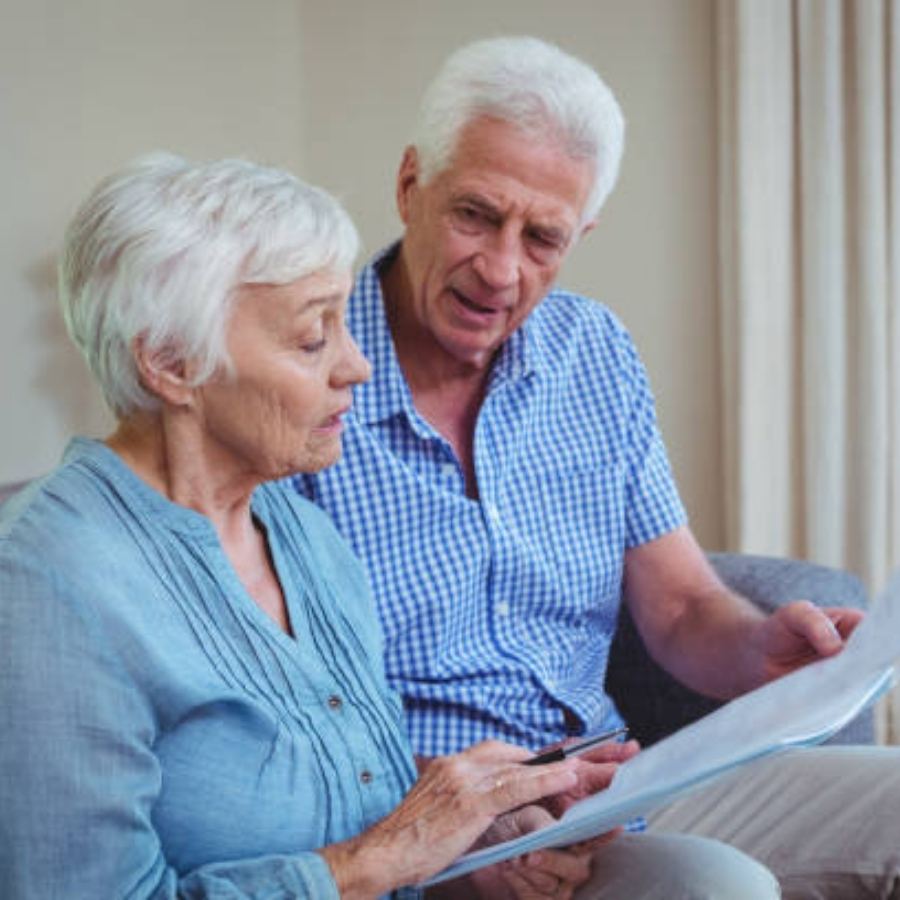 senior couple reviewing timeshare contract