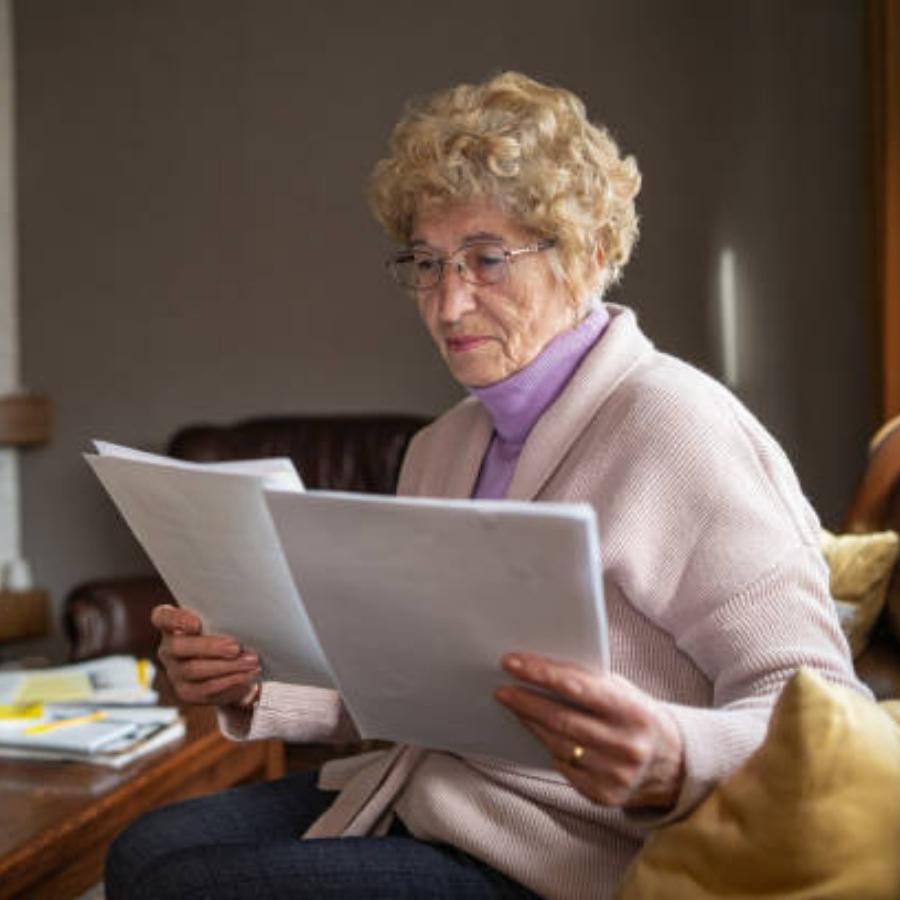 senior woman reviewing a timeshare contract