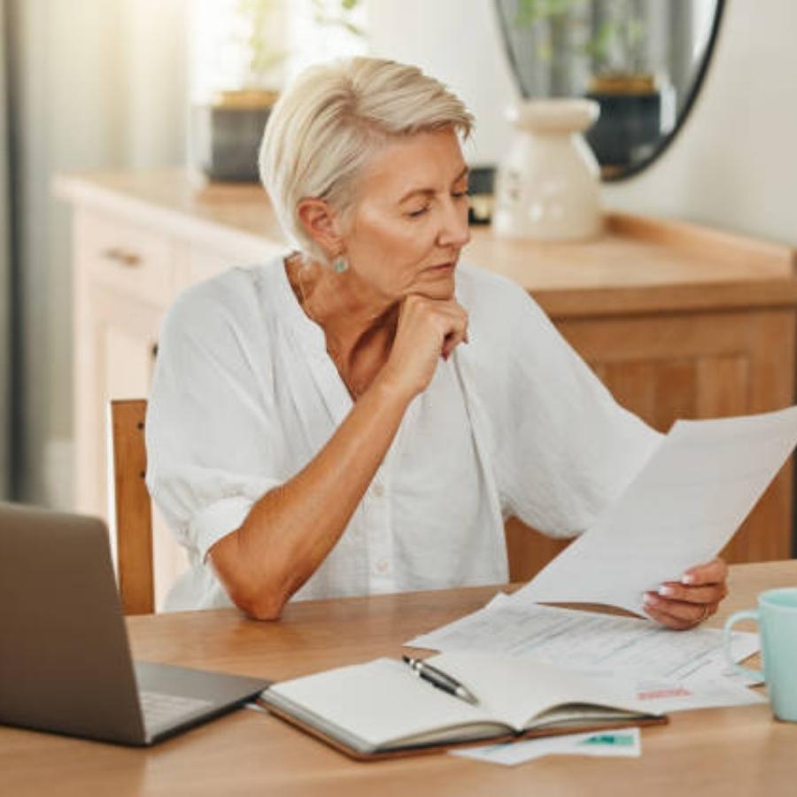 senior woman reviewing a timesahre contract