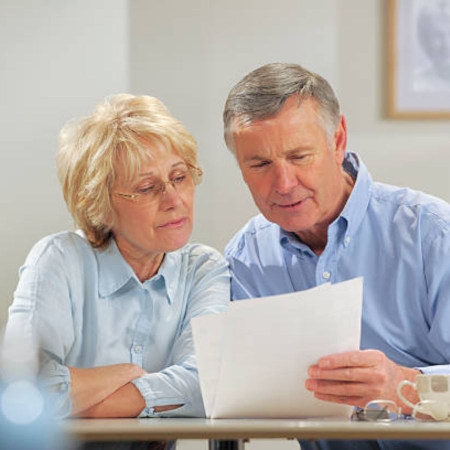 senior couple reviewing timeshare contract