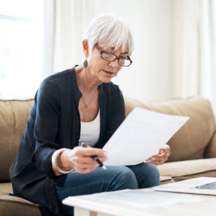 senior woman reviewing a timeshare contract