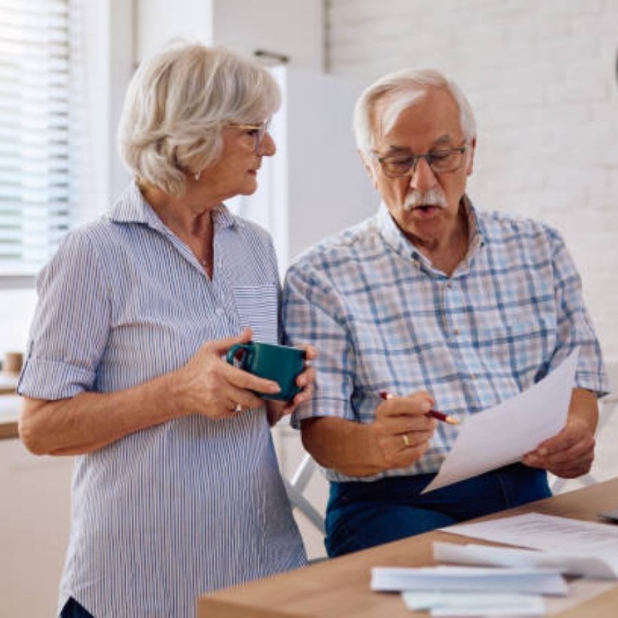 senior couple reviewing timeshare contract