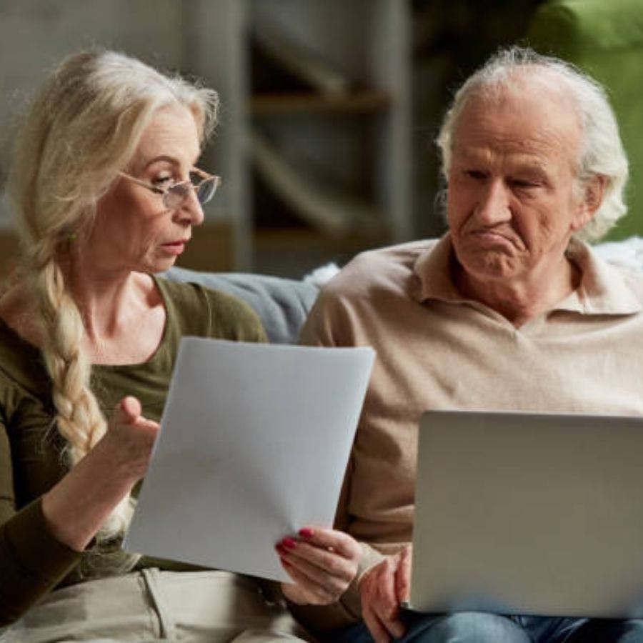 senior couple reviewing timeshare contract