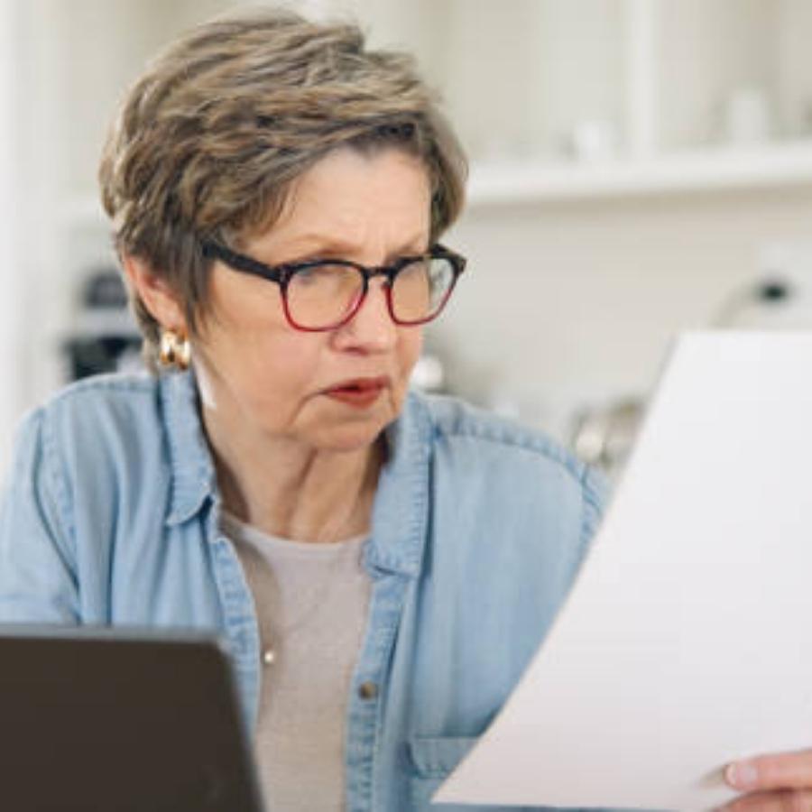 senior woman reviewing a timeshare contract
