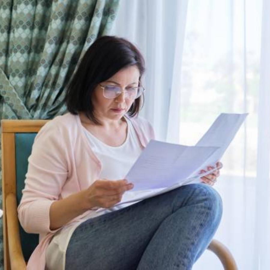 senior woman reviewing a timeshare contract