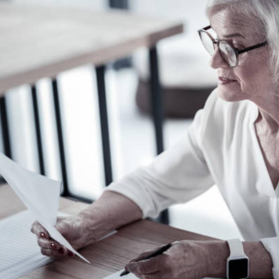 senior women reviewing timeshare cancellation contract