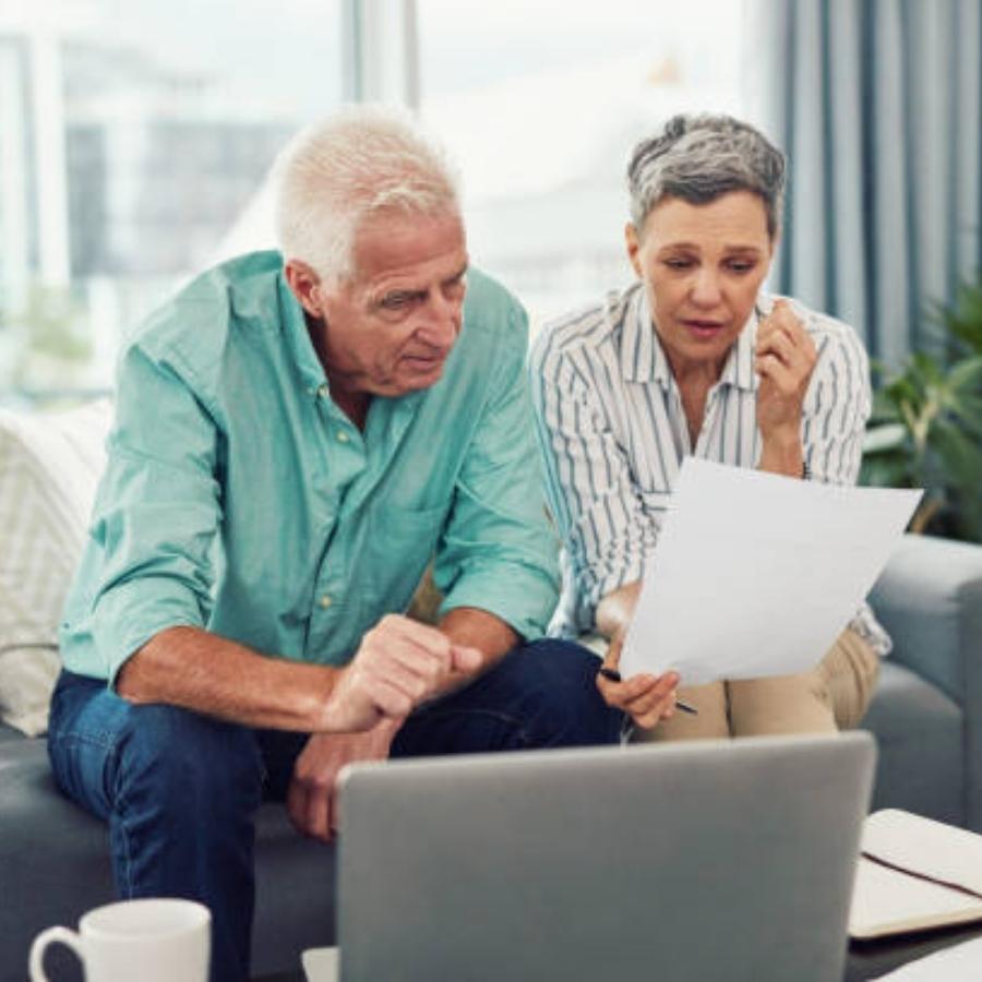 stressed senior couple reviewing timeshare cancellation contract