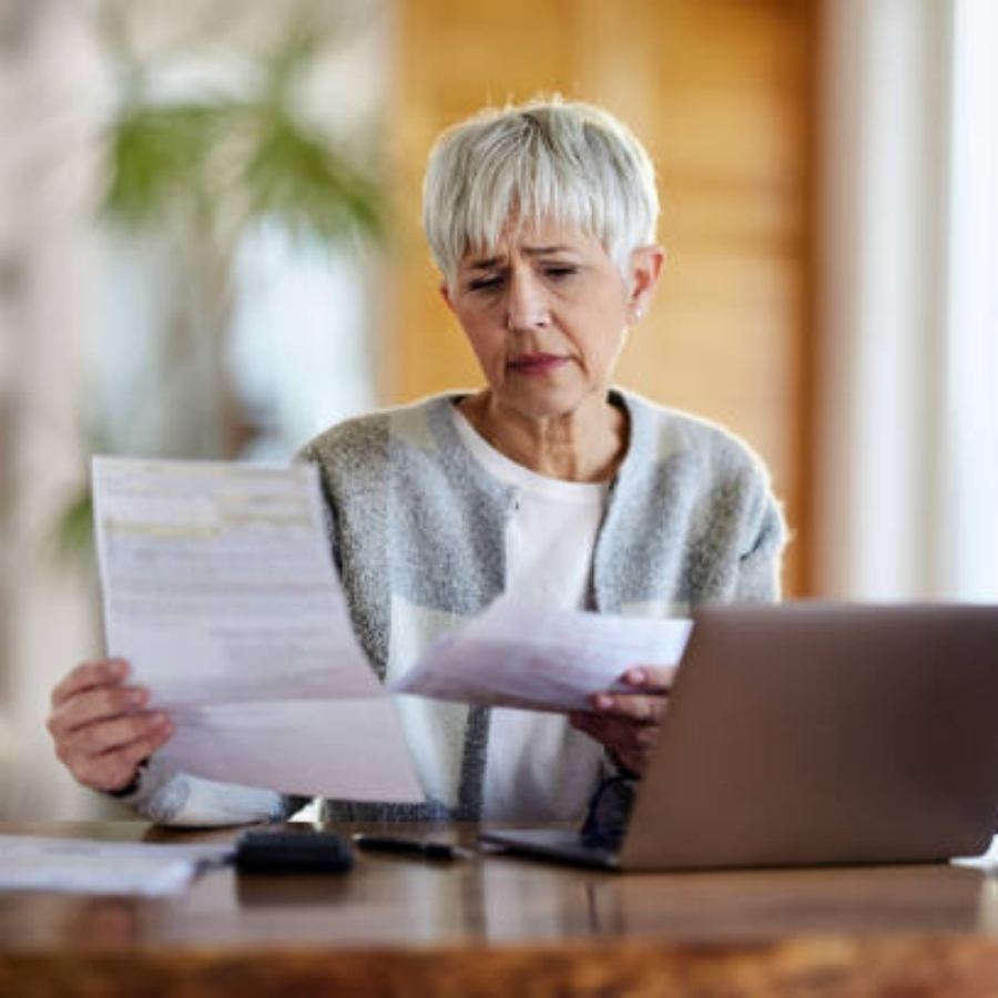 senior woman reviewing timeshare contract