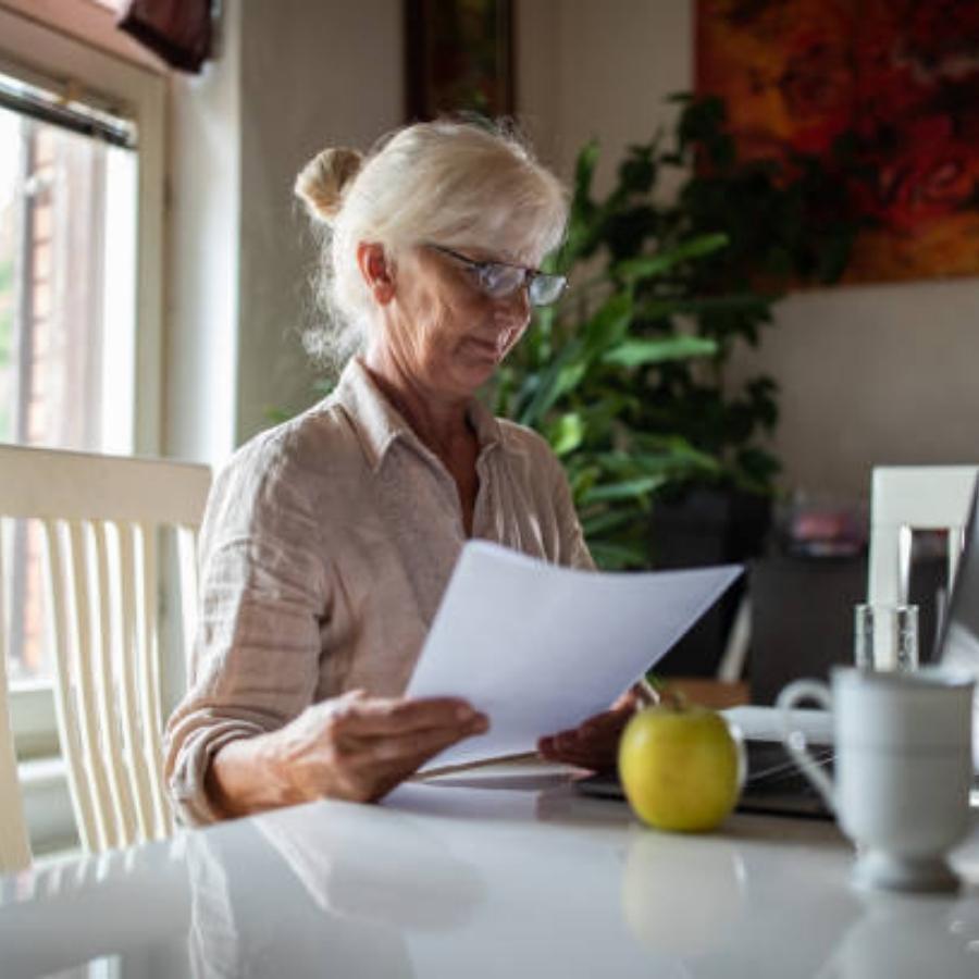 senior woman reviewing a timeshare contract