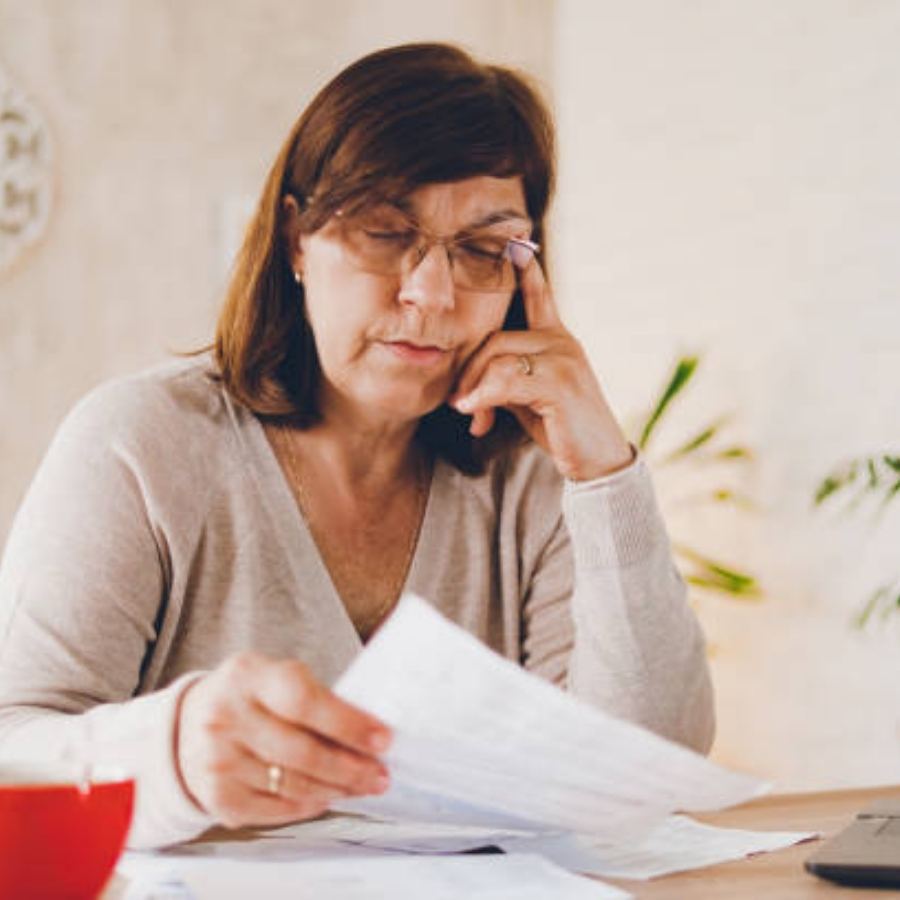 senior woman reviewing timeshare contract