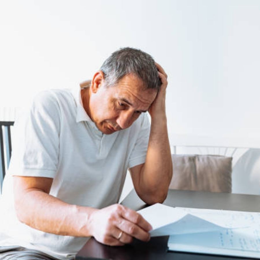 senior man reviewing timeshare contract