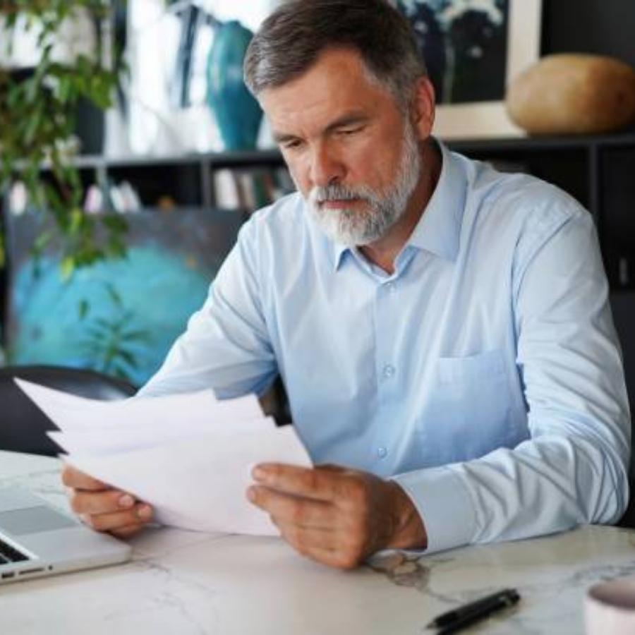 senior man reviewing a timeshare contract