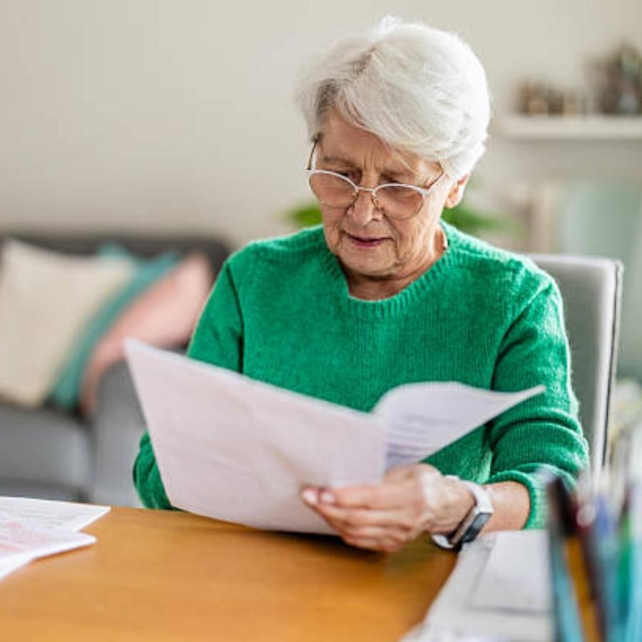 senior woman reviewing a timeshare contract