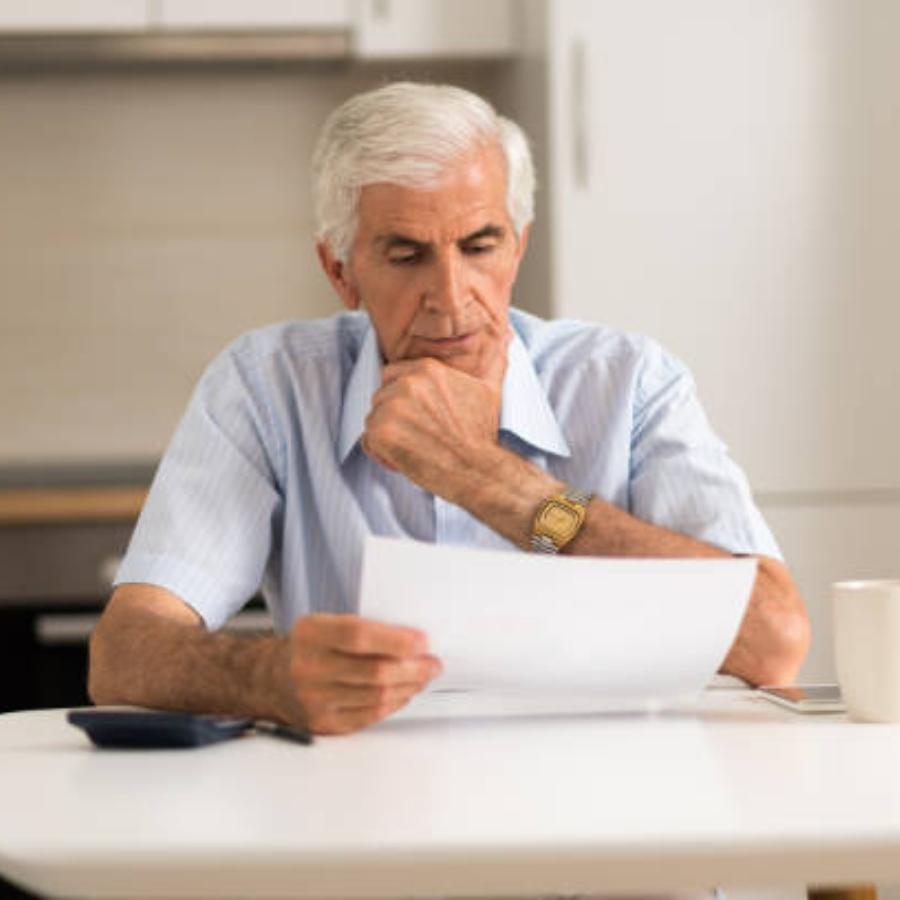 senior man reviewing a timeshare contract