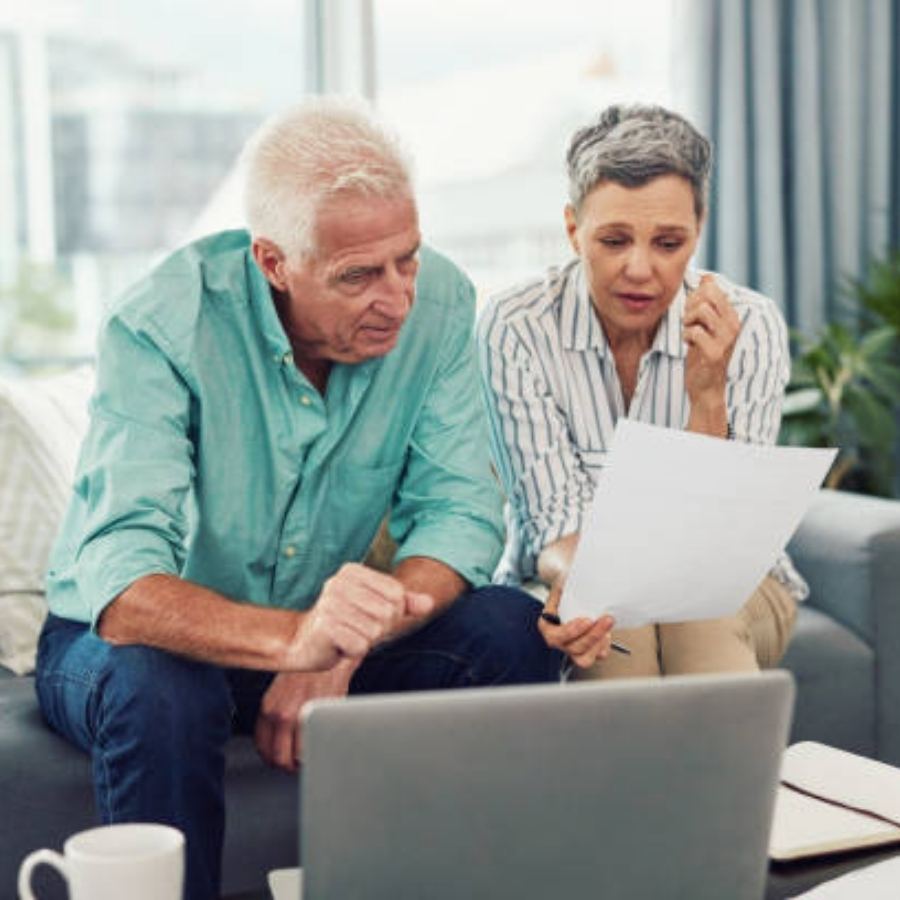 senior couple reviewing timeshare contract